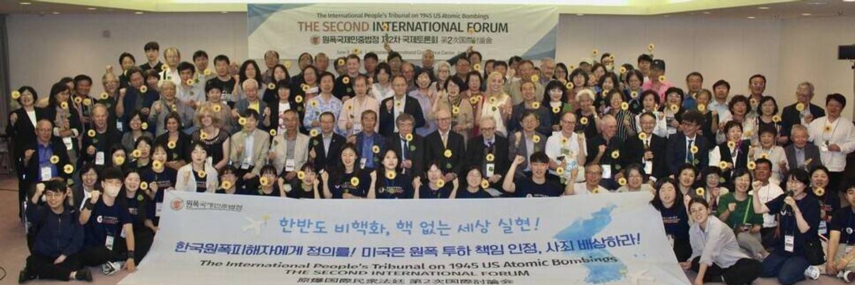 Attendees pose at the Second International Forum of the International People's Tribunal on 1945 US Atomic Bombings.