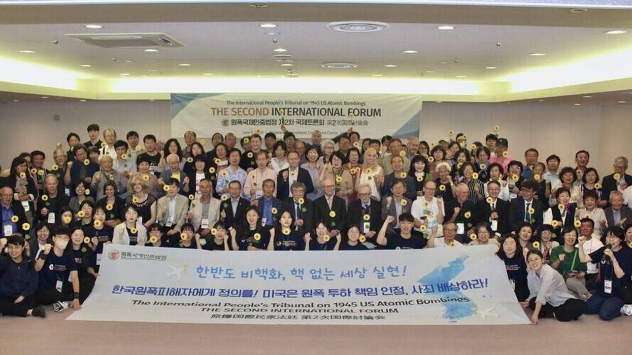 Attendees pose at the Second International Forum of the International People's Tribunal on 1945 US Atomic Bombings.
