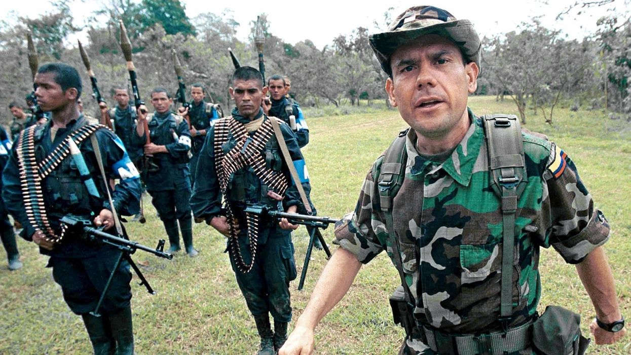 AUC leader Carlos Castaño with some of his troops