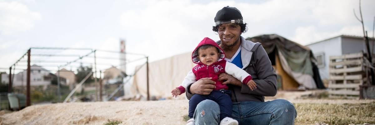 Awdah Hathaleen and his oldest son.