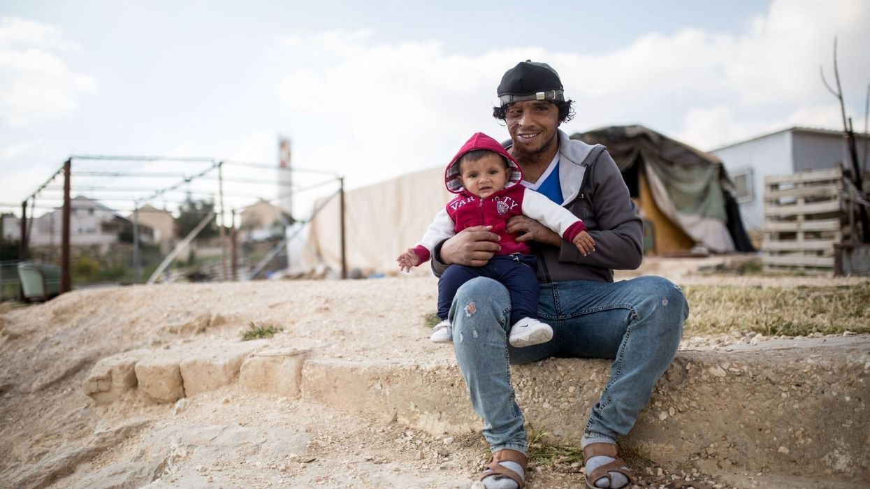 Awdah Hathaleen and his oldest son.