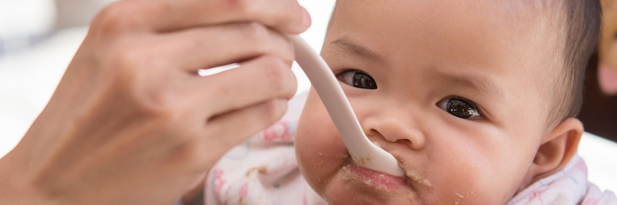 baby being spoon-fed