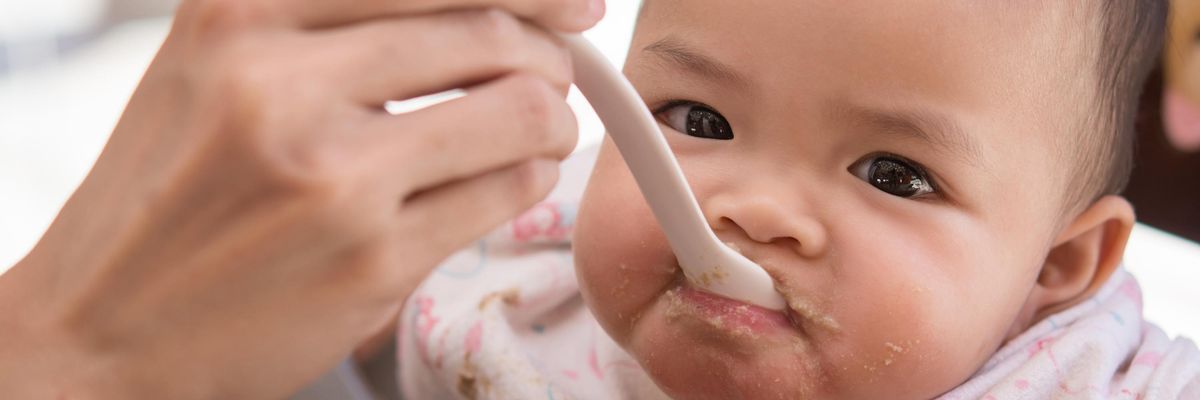 baby being spoon-fed