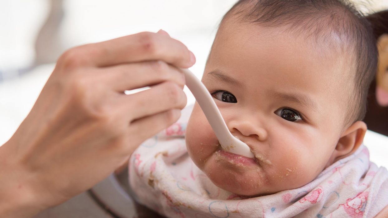 baby being spoon-fed