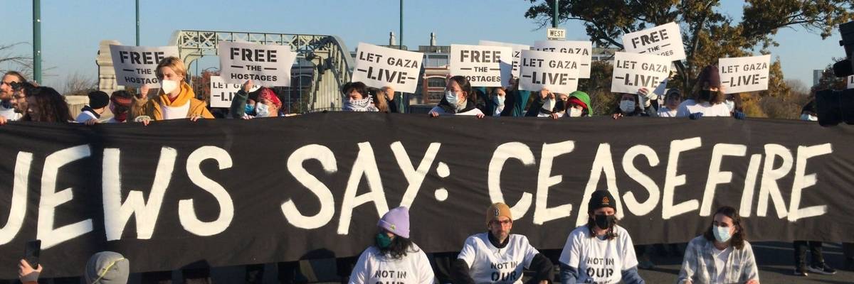 banner reads: Jews say: cease-fire
