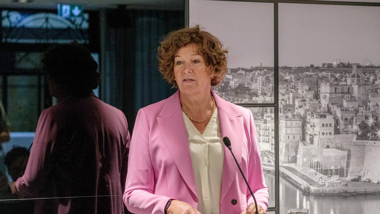 Belgian Deputy Prime Minister Petra De Sutter speaks, wearing a pink blazer and white blouse.