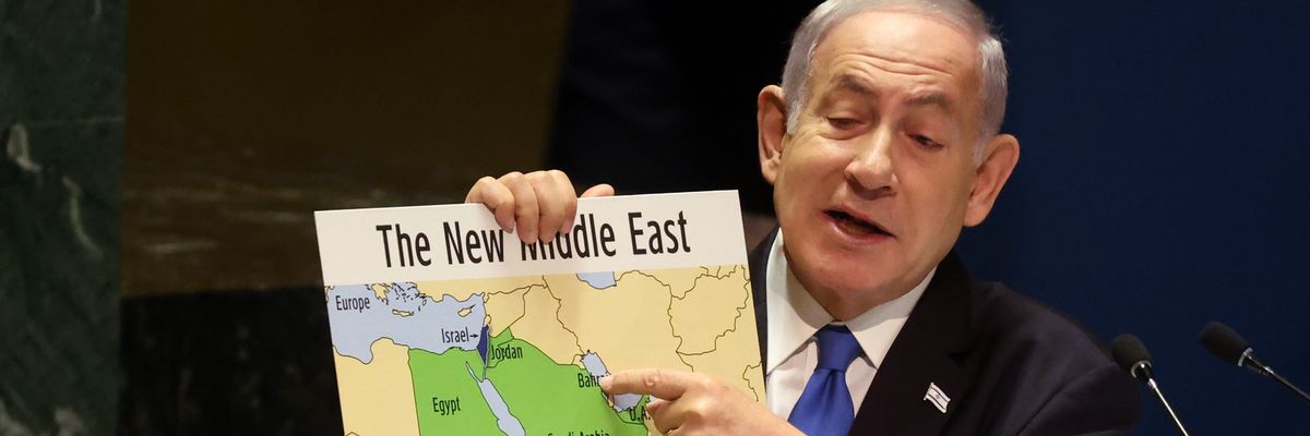 Benjamin Netanyahu holds a map of the Middle East without Palestine