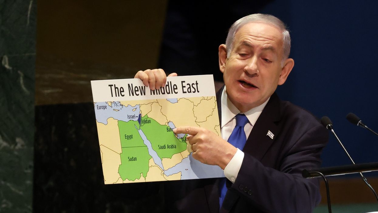 Benjamin Netanyahu holds a map of the Middle East without Palestine