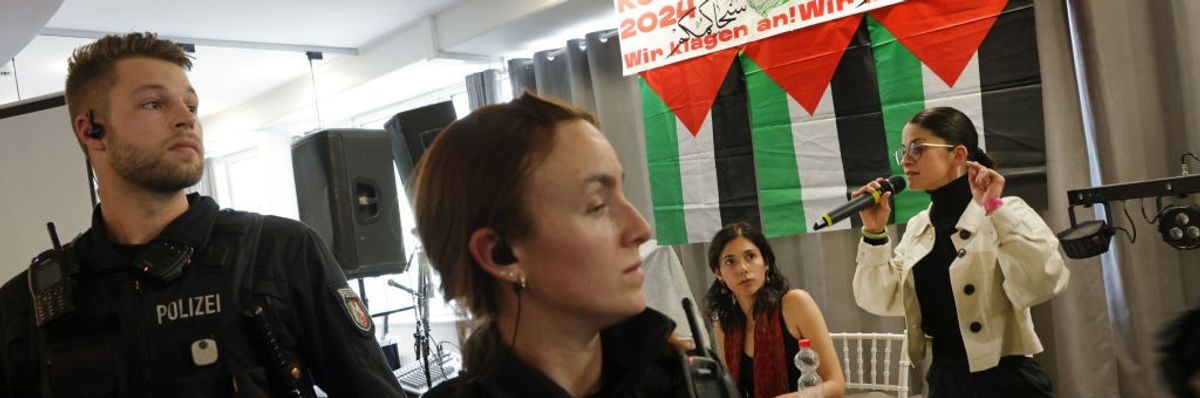 Berlin police break up the Palestine Congress as a woman speaks