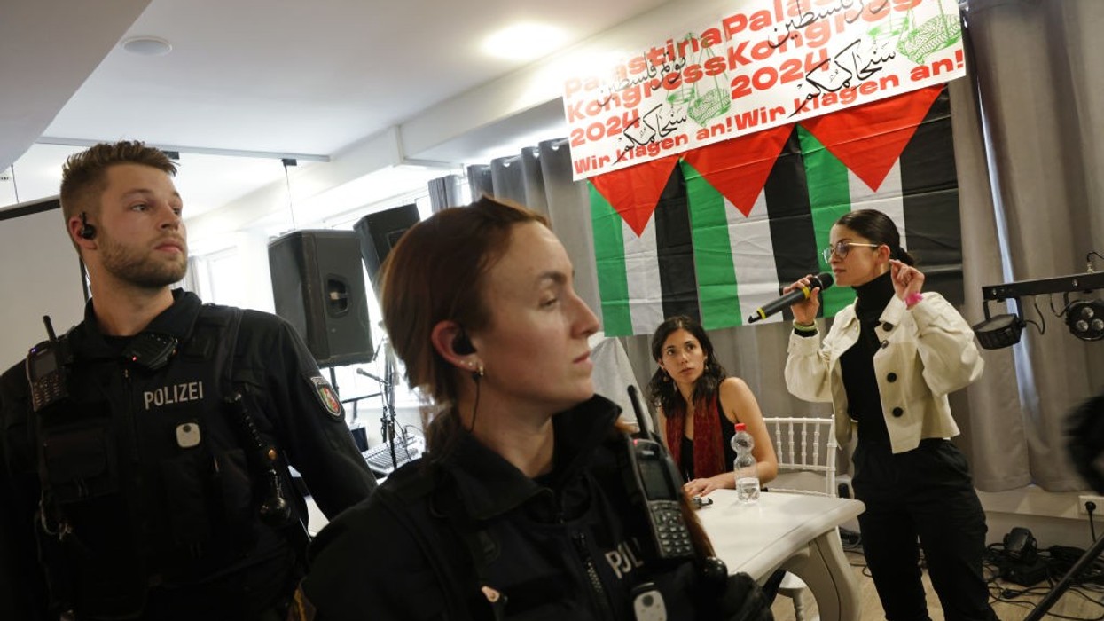 Berlin police break up the Palestine Congress as a woman speaks