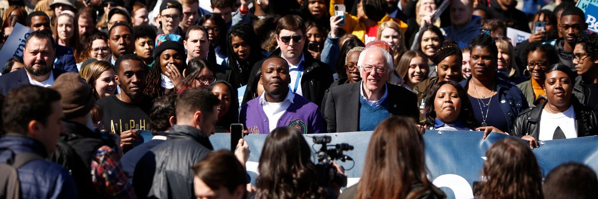 Bernie Sanders and supporters march in 2020