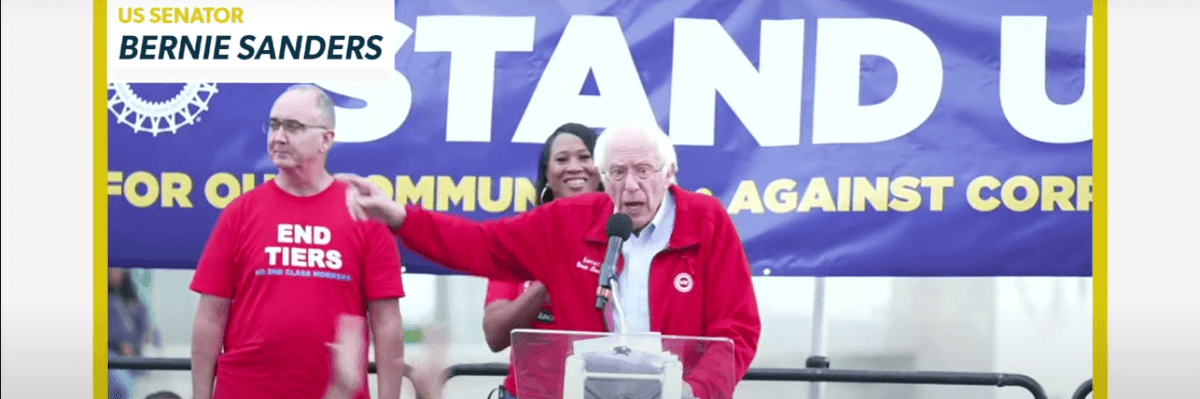 Bernie Sanders points while speaking at a UAW rally.