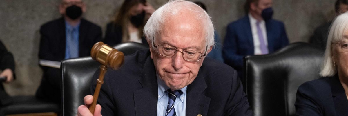 Bernie Sanders uses his gavel during a Senate HELP Committee hearing 