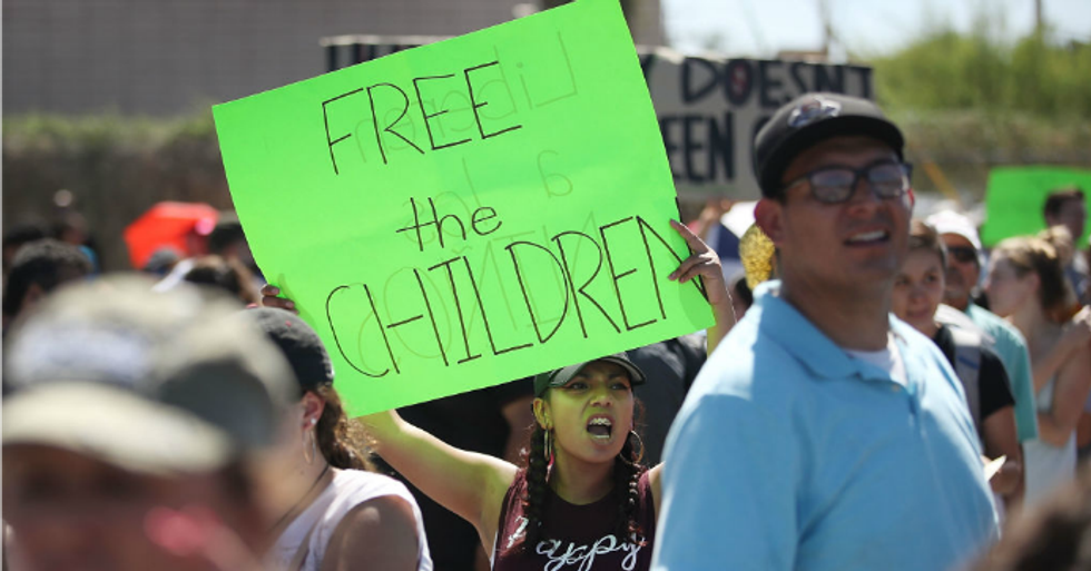 Bianey Reyes and others protest the separation of children from their parents in front of the El Paso Processing Center, an immigration detention facility, at the Mexican border on June 19, 2018 in El Paso, Texas. (Photo: Joe Raedle/Getty Images)