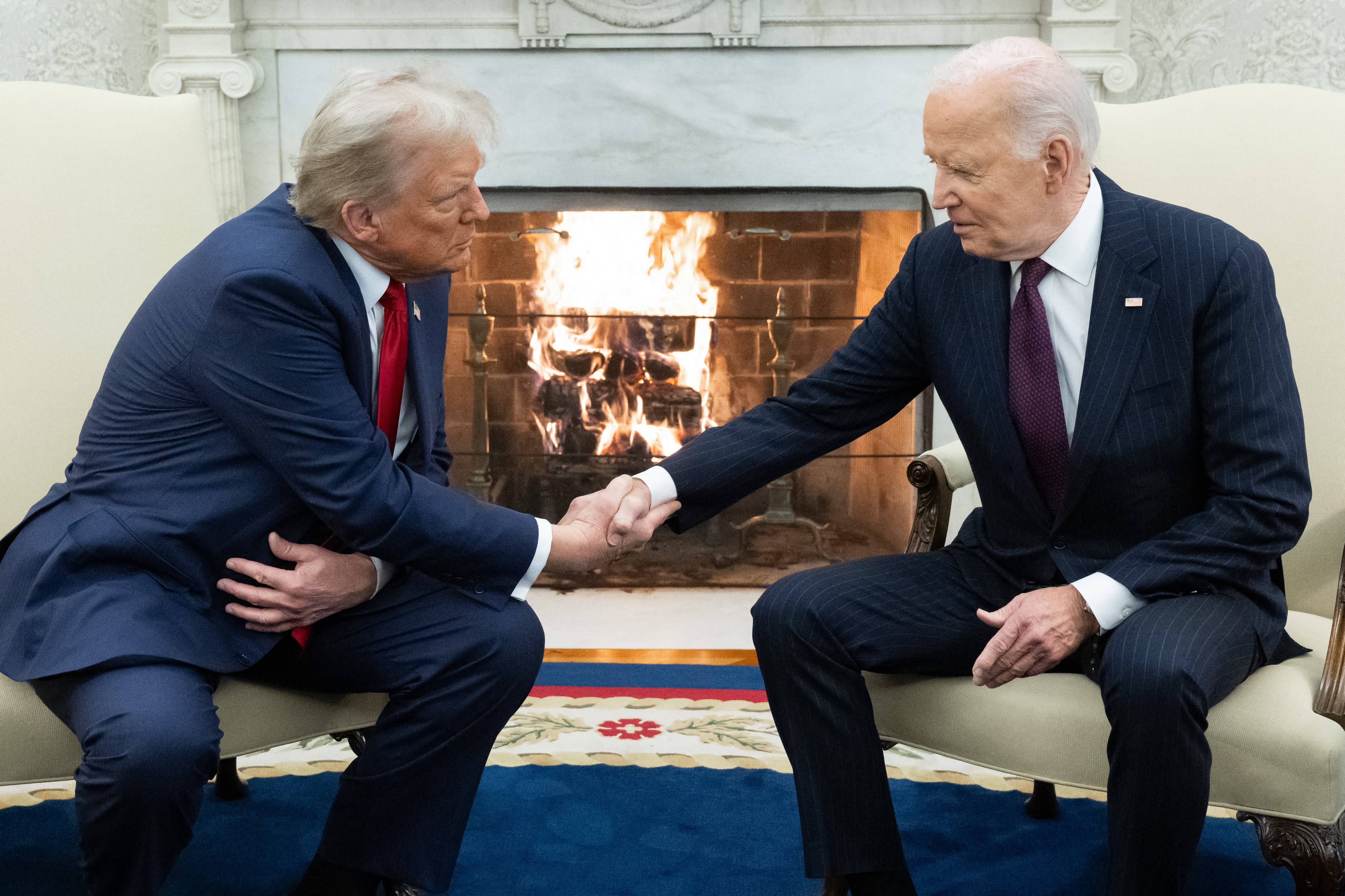 Biden and Trump shake hands.