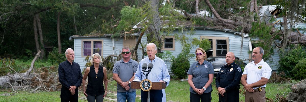 Biden speaks in front of a home destroyed by a hurricane