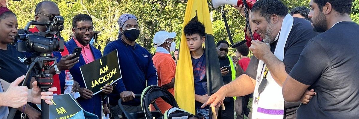 Bishop William J. Barber II speaks into a bullhorn during a march for clean public water in Jackson, Mississippi on September 26, 2022.