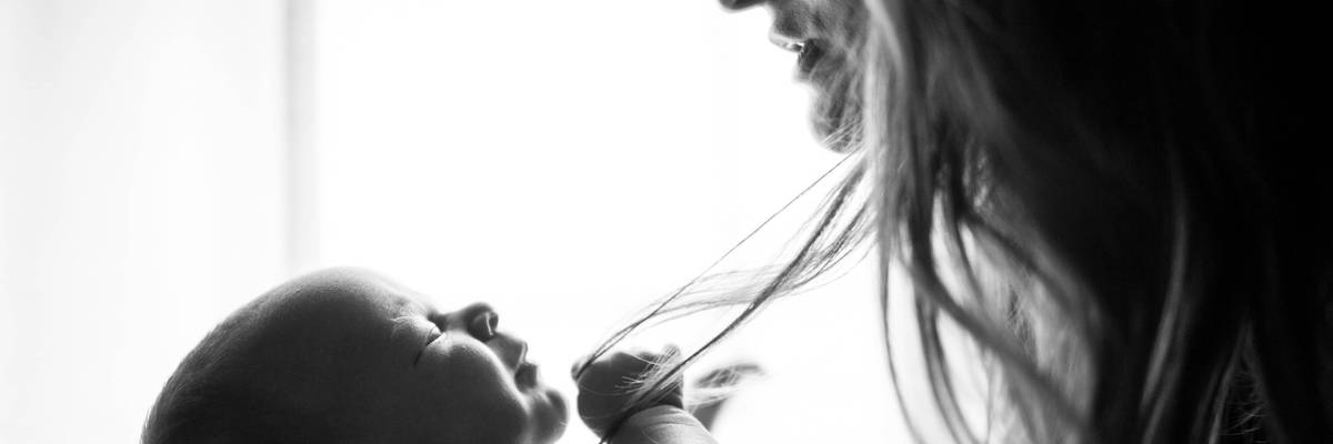 Black and white photo of a mother and baby.