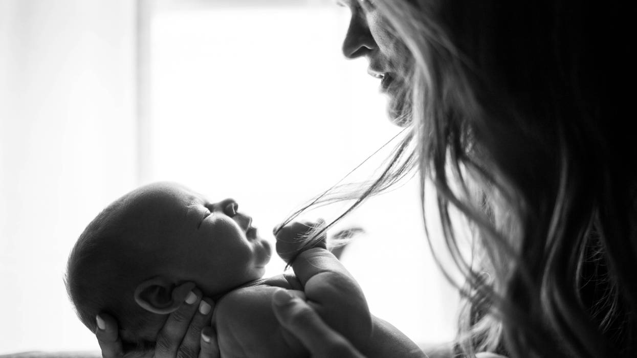 Black and white photo of a mother and baby.