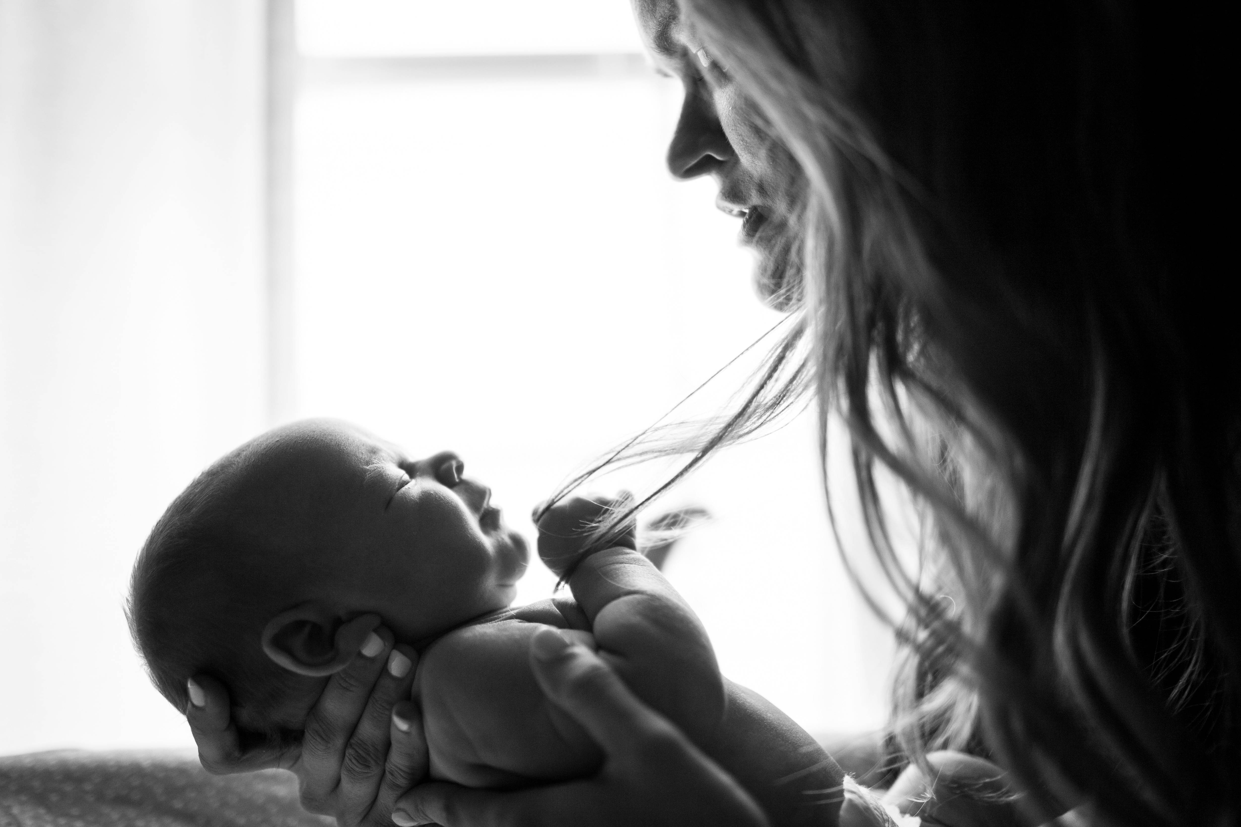 Black and white photo of a mother and baby.