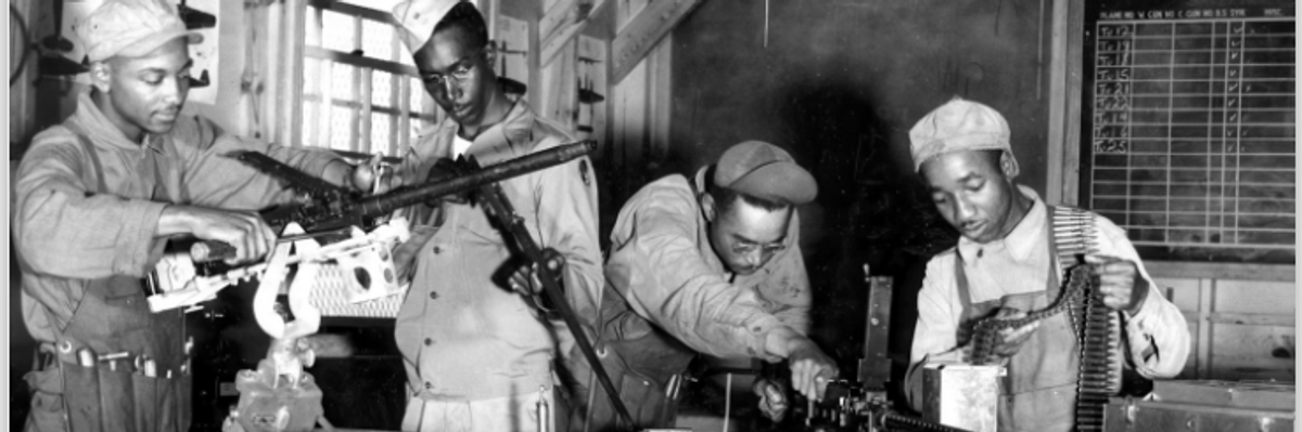 Black armorers and other Air Force ground personnel train during World War ll