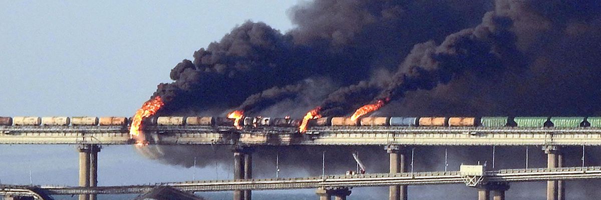 Black smoke billows from a fire on the Kerch Strait Bridge that links Crimea to Russia, after a truck exploded on October 8, 2022. 
