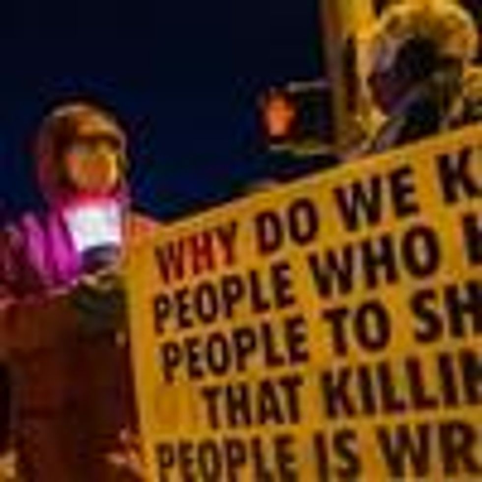 Bloomington, Indiana anti-death-penalty activist Glenda Breeden holds a lamp on Jan. 12, 2021 while protesting against the then-pending execution of Lisa Montgomery, and two others, at Terre Haute Federal Prison this week. Montgomery was to be put to death on Wednesday. President Donald Trump's administration has sped up the execution of prisoners on death row during the last months of his presidency. (Photo: Jeremy Hogan/SOPA Images/LightRocket via Getty Images)