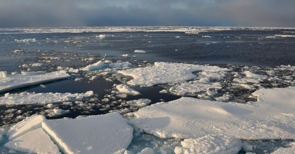 Blue sky begins to break through the clouds over Arctic Ocean ice Sept. 9, 2009. (Photo: Patrick Kelley/U.S. Coast Guard/public domain)