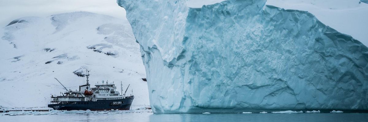 Boat beside glacier
