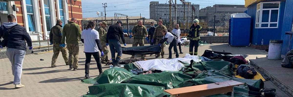 Bodies are covered at a train station in eastern Ukraine