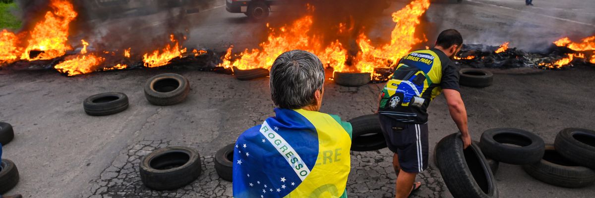Bolsonaro supporters form a burning barricade to block a road on October 31, 2022 in Varginha, Brazil.