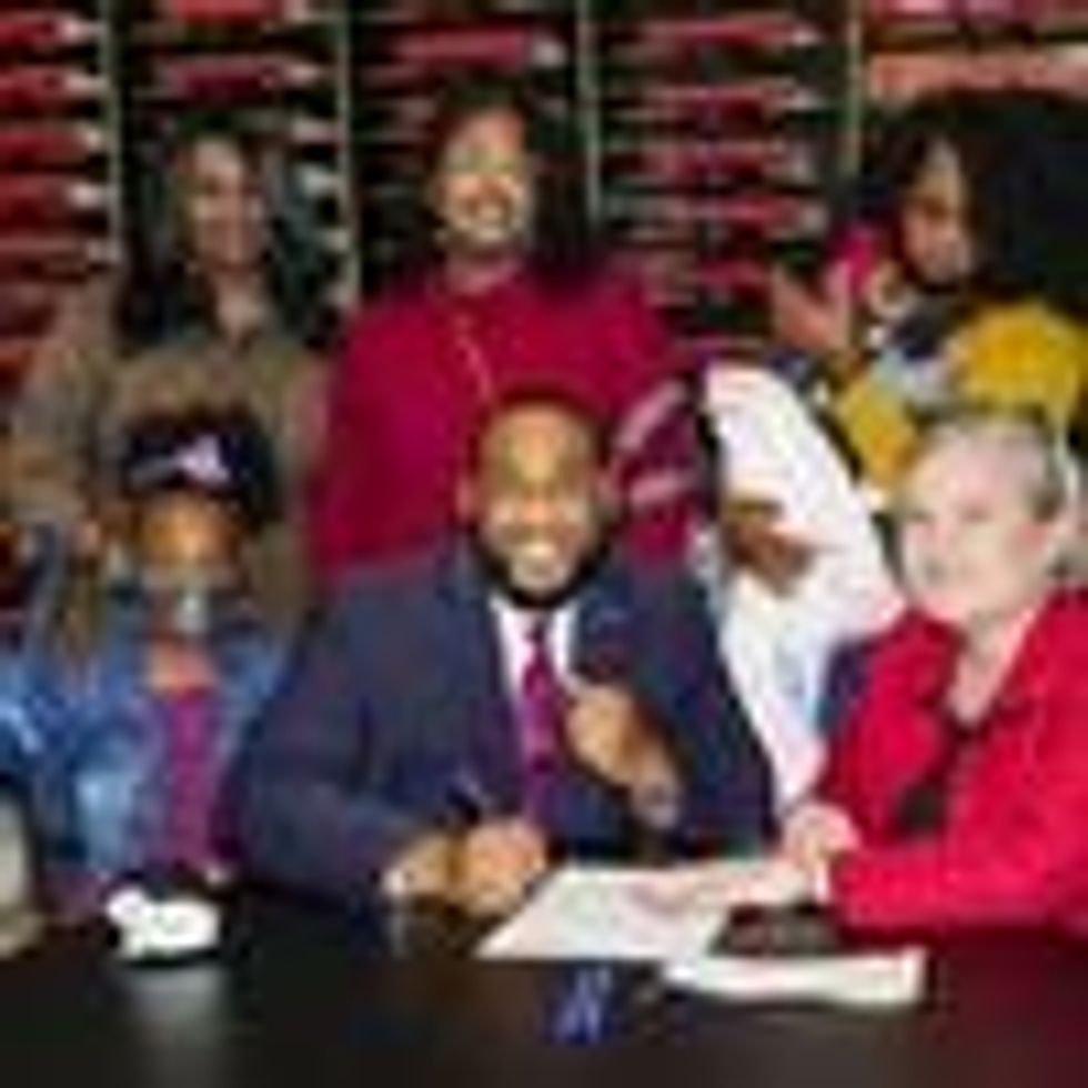 Booker signing papers