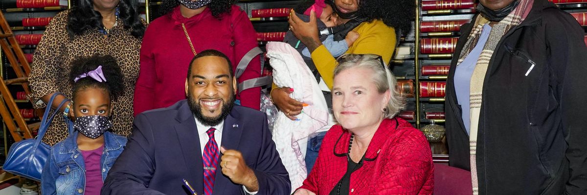 Booker signing papers