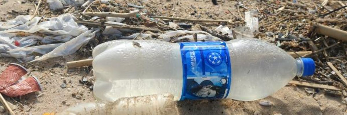 Bottles are strewn across a popular beach in Beirut