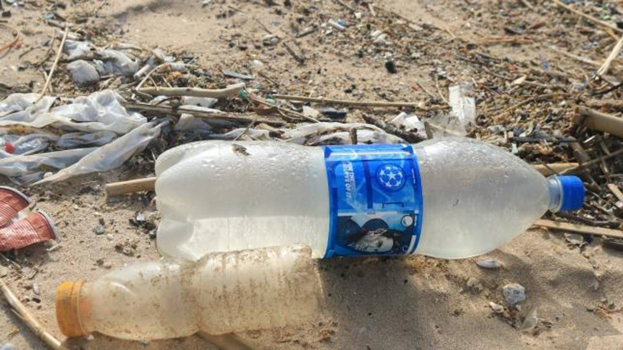 Bottles are strewn across a popular beach in Beirut
