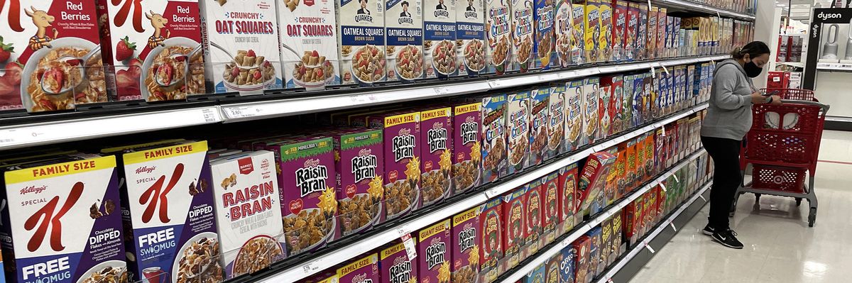Boxes of cereal are displayed on a shelf