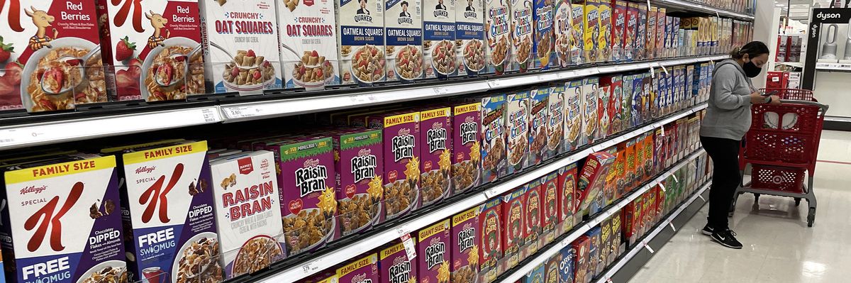 Boxes of cereal are displayed on a shelf 