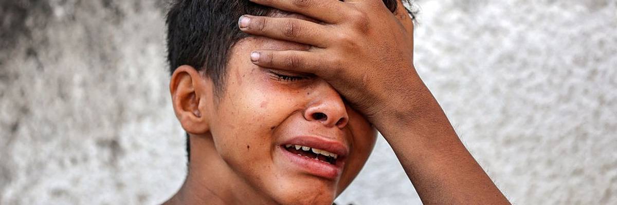 Boy cries during funeral in Gaza