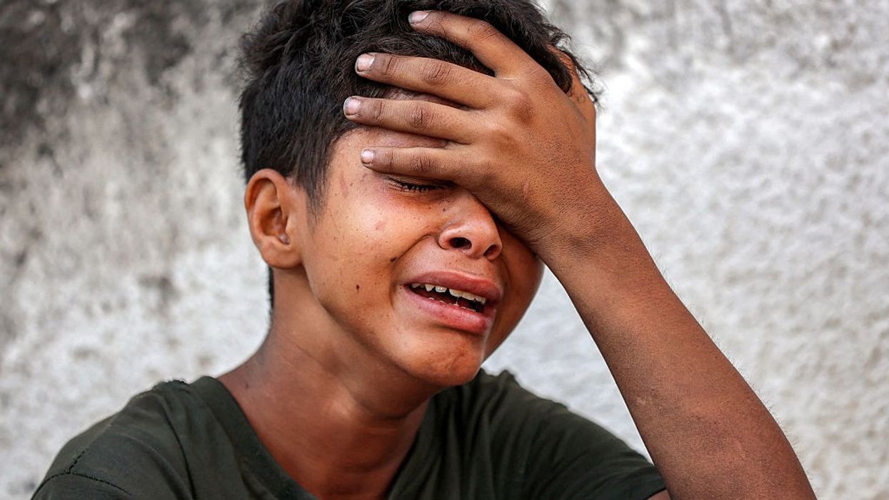 Boy cries during funeral in Gaza