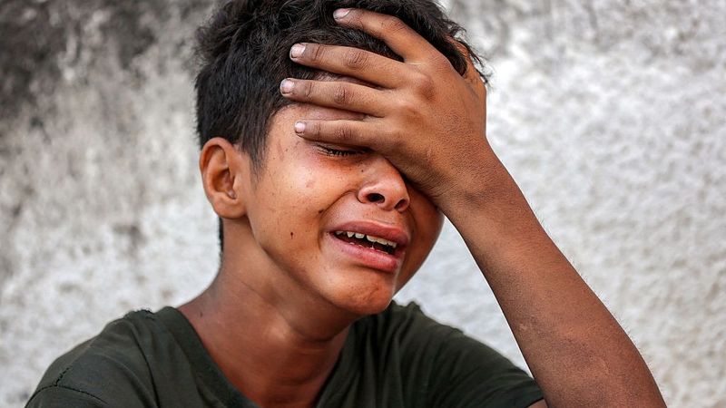 Boy cries during funeral in Gaza