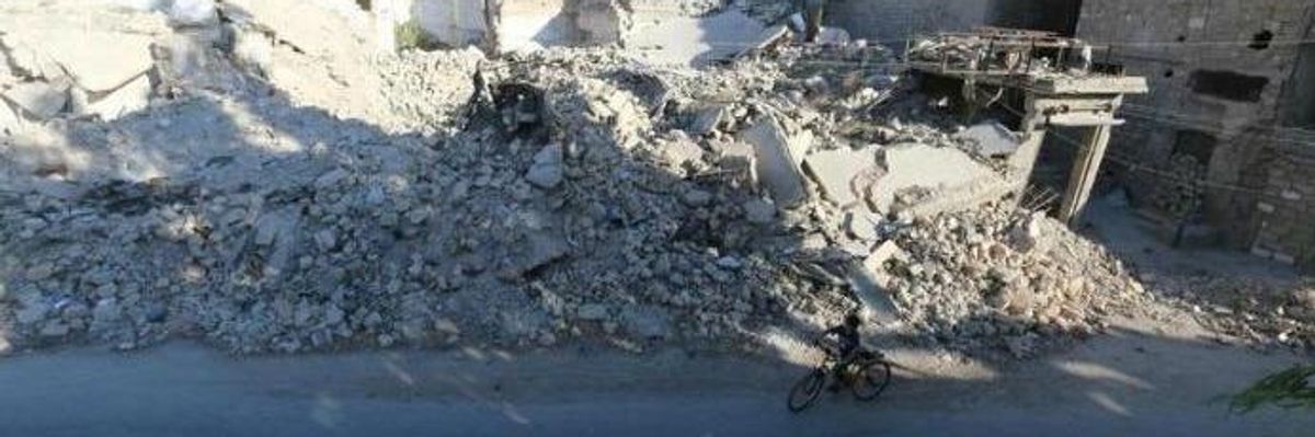 Boy in rubble in Syria.