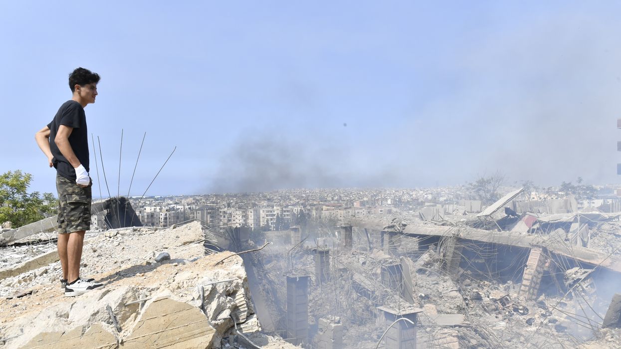 Boy overlooks damage of Israeli bombardment of Lebanon.