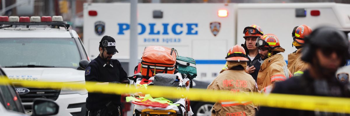 Brooklyn subway shooting aftermath show first responders and ambulance stretcher