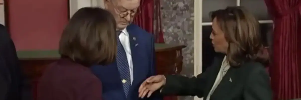 Bruce Fischer, husband of Republican Sen. Deb Fischer, rejects a handshake from Vice Prsident Kamala Harris