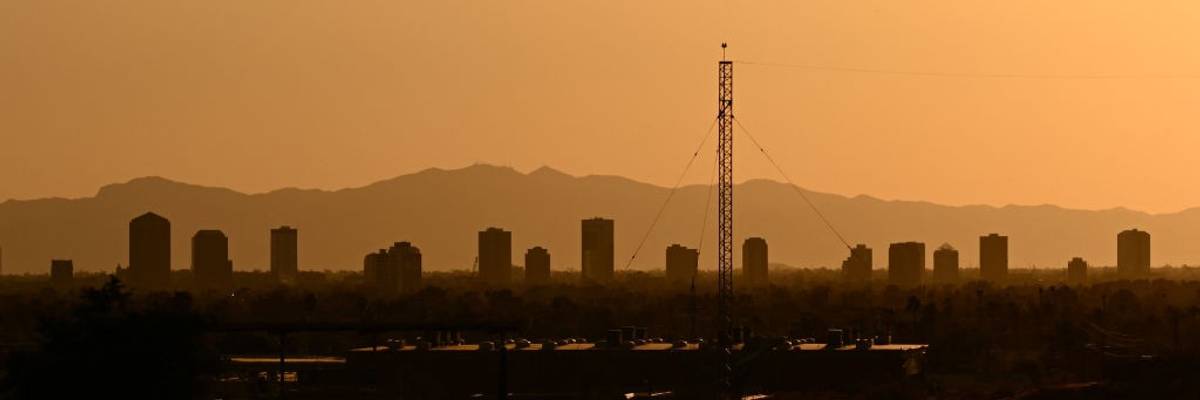 Buildings blur at sunset in a Phoenix, Arizona, heatwave.