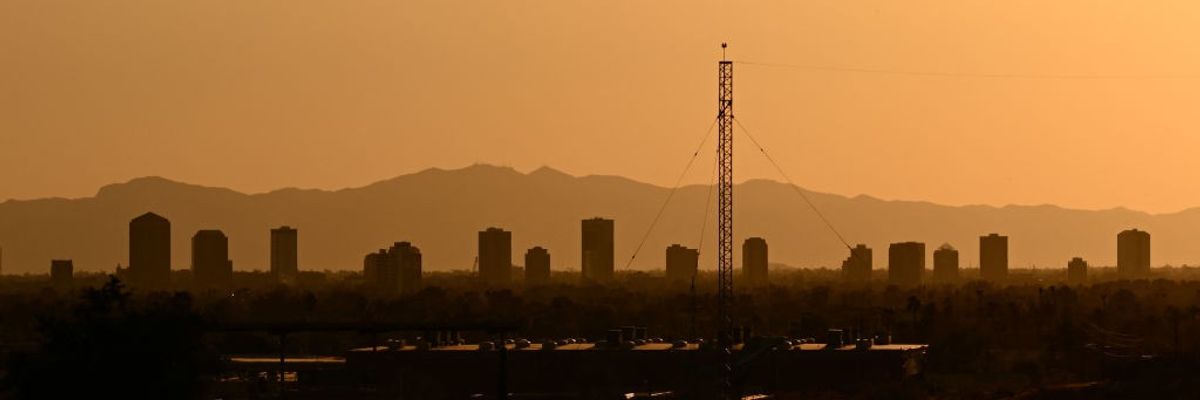 Buildings blur at sunset in a Phoenix, Arizona, heatwave.
