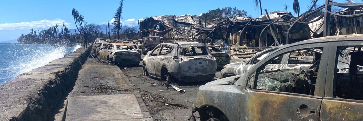 Burned cars and destroyed buildings are pictured in the aftermath of a wildfire in Lahaina, western Maui, Hawaii on August 11, 2023.