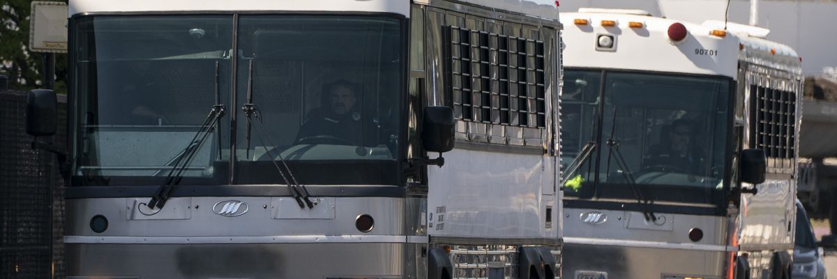 Buses transfer migrants to and from a deportation flight