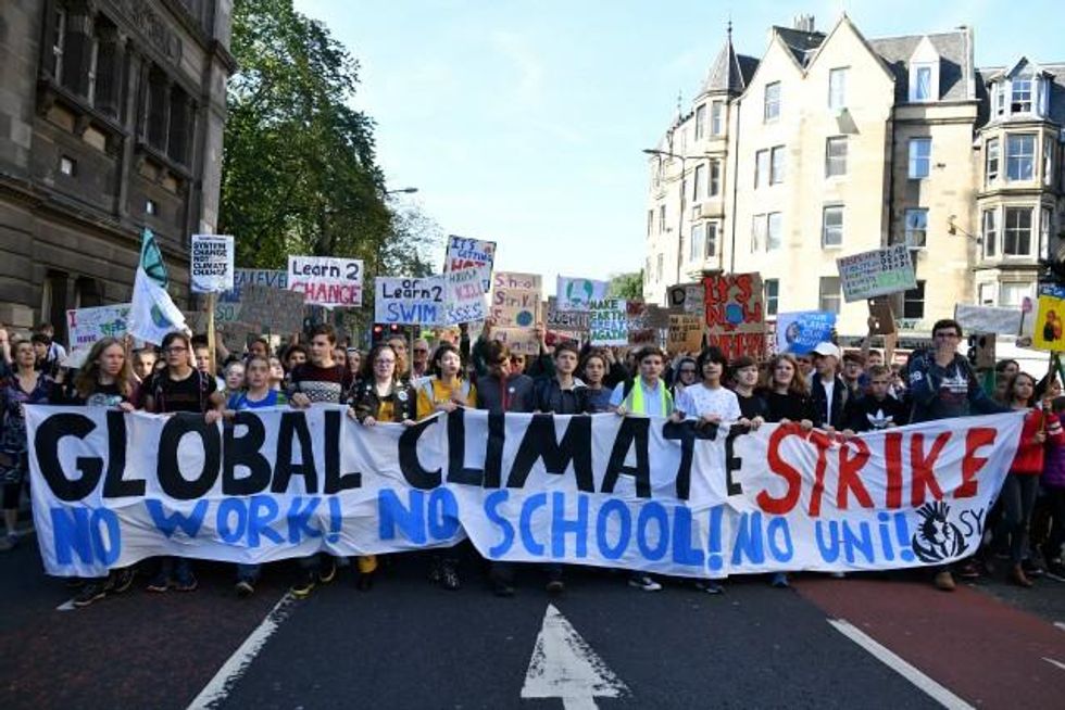 campaigners protest during a climate change action day on September 20, 2019 in Edinburgh, Scotland. Protests are taking place today worldwide, with campaigners demanding that governments and corporations take steps towards lowering CO2 emissions and combating the warming of the Earth's temperatures. (Photo by Jeff J Mitchell/Getty Images)