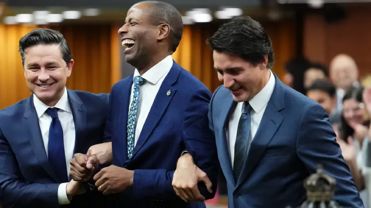 Canada's new Speaker of the House of Commons Greg Fergus escorted by Conservative Leader Pierre Poilievre and PM Justin Trudeau